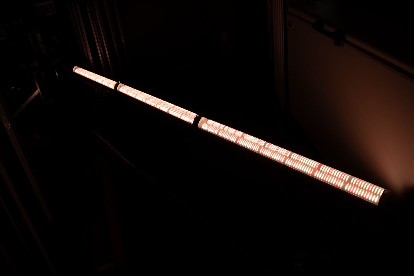 Inter-lighting LED bars glowing between crop rows
